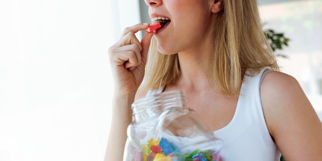 Woman eating candy