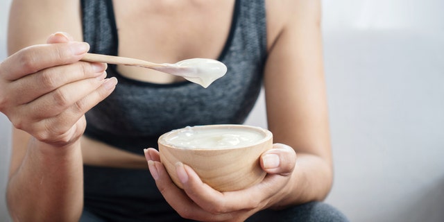 Woman eating yogurt