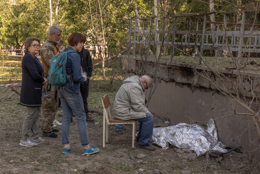 A man mourns over the body of his granddaughter killed during a Russian missile attack on June 1, 2023 in Kyiv, Ukraine.