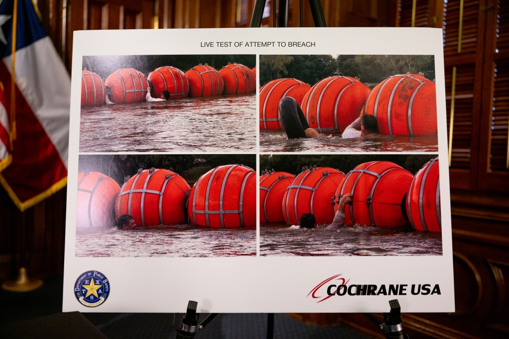 A poster illustrating new border security implementation is displayed during a news conference at the Texas State Capitol on June 8, 2023, in Austin, Texas. 