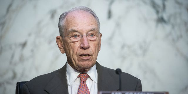 Sen. Chuck Grassley speaks into mircrophone during hearing