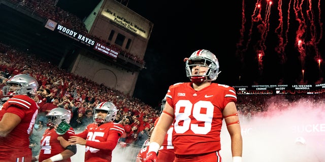 Zak Herbstreit walks onto the field