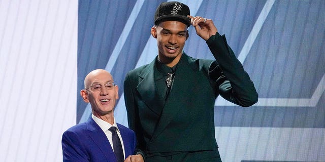 Victor Wembanyama and NBA commissioner Adam Silver