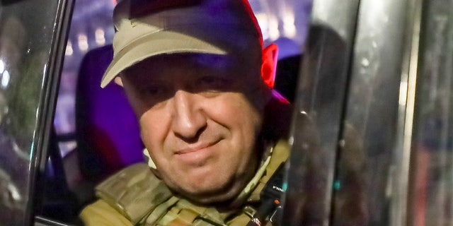 Prigozhin looks on from a street vehicle in Russia