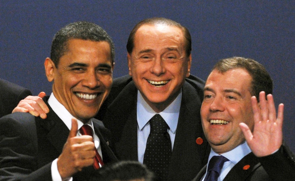 Barack Obama laughs with Italy's Prime Minister Silvio Berlusconi and Russia's President Dmitry Medvedev as they pose for a photo at the G20 summit at the ExCel centre, in east London, Britain, on April 2, 2009.    