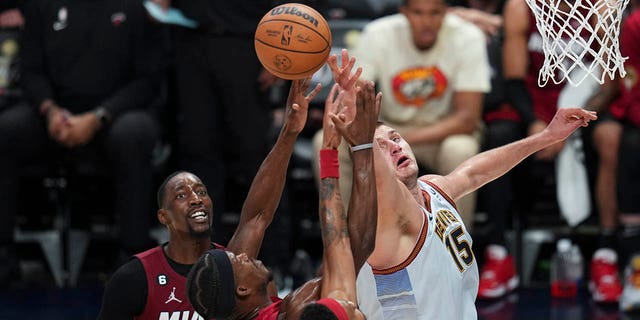 Nikola Jokic tries to grab the ball