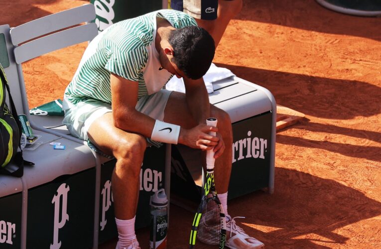French Open: Fans boo as Carlos Alcaraz forced to forfeit game after attack of cramp against Novak Djokovic