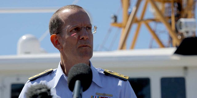 Rear Admiral John Mauger, the First Coast Guard District commander speaks during a press conference