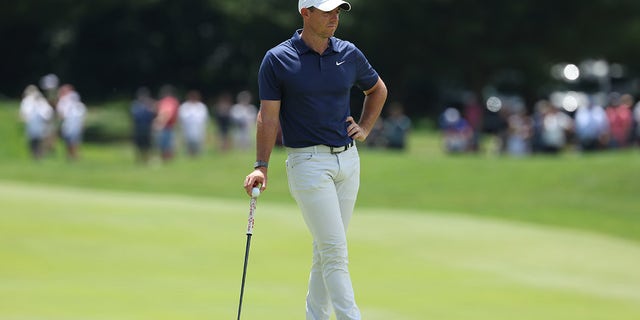 Rory McIlroy waits on course