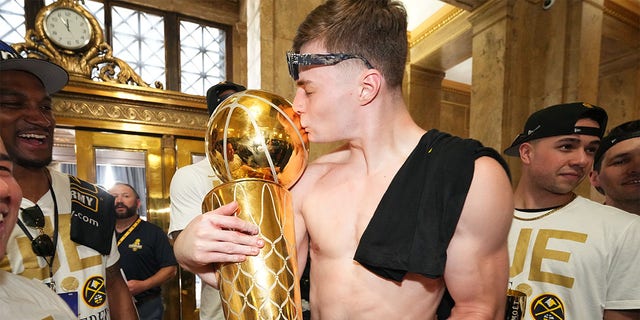 Christian Braun with Larry OBrien trophy