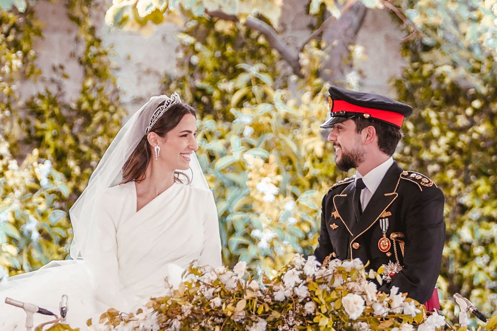 Crown Prince Hussein and his wife Saudi Rajwa al-Seif share a moment during their wedding ceremony at the Zahran Palace in Amman on June 1, 2023.