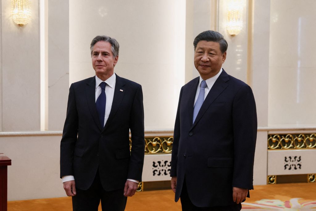 China's President Xi Jinping stands next to US Secretary of State Antony Blinken prior to their meeting at the Great Hall of the People in Beijing on June 19, 2023. 