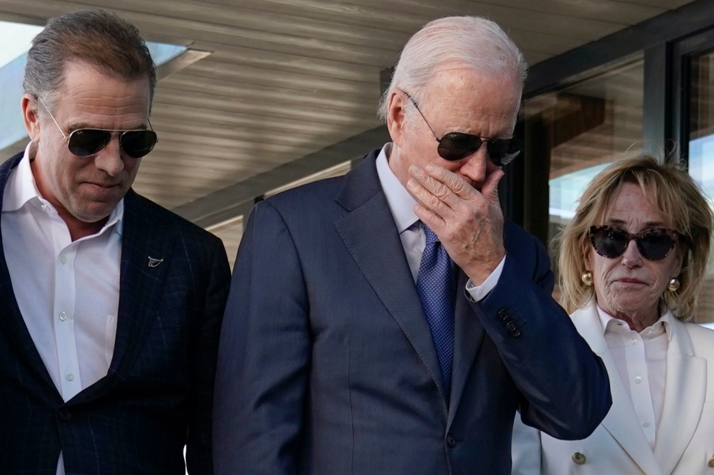 President Joe Biden stands with his son Hunter Biden, left, and sister Valerie Biden Owens, right, as he looks at a plaque dedicated to his late son Beau Biden while visiting Mayo Roscommon Hospice in County Mayo, Ireland, Friday, April 14, 2023. 