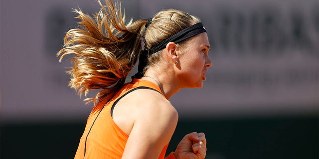 Marie Bouzkova celebrates winning a point