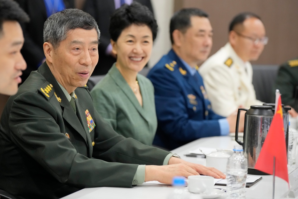 Chinese Defense Minister Gen. Li Shangfu, left, talks during a meeting at the defense ministry in Singapore, on June 1, 2023.