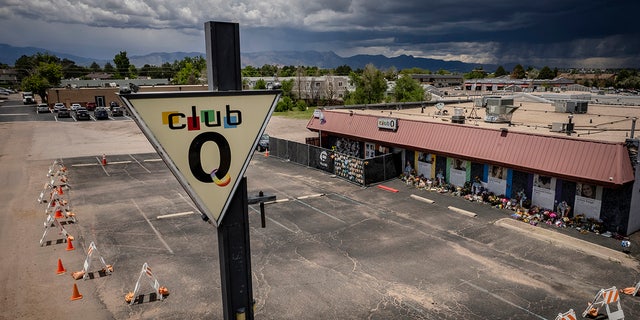 Parking lot of Club Q adorned with flowers