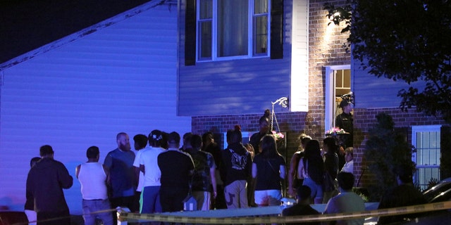 People in the front yard of a home