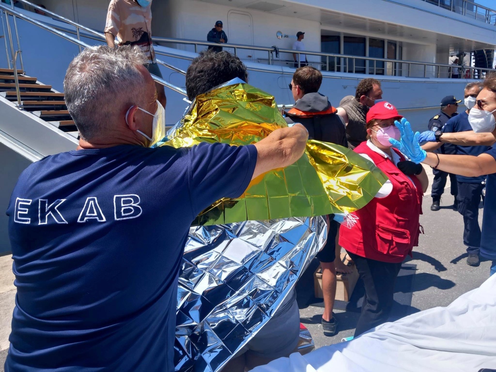 Survivors receive first aid after a rescue operation at the port in Kalamata town on June 14, 2023.