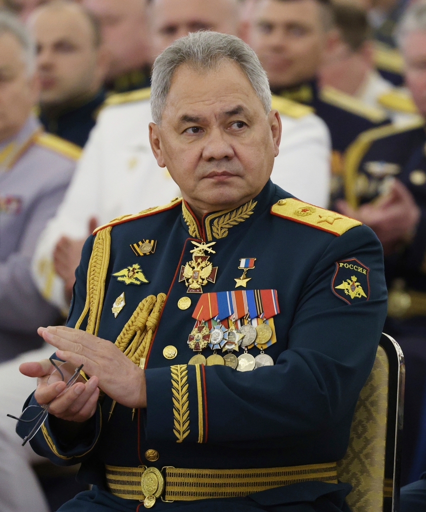 Shoigu applauds as he attends a meeting of graduates of military higher education institutions with Russian President Vladimir Putin at the Kremlin in Moscow, Russia, Wednesday, June 21, 2023. 