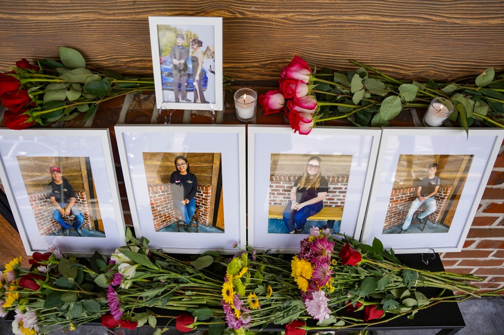 Portraits of five teens who drowned sit on display at a Texas Roadhouse in Fort Myers, Fla., on June 26, 2023. 