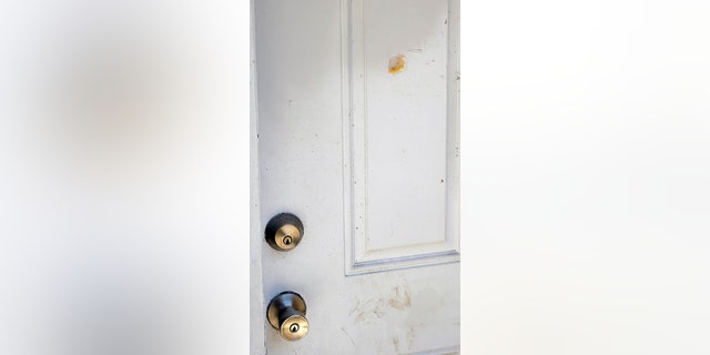 patched up bullet hole in door