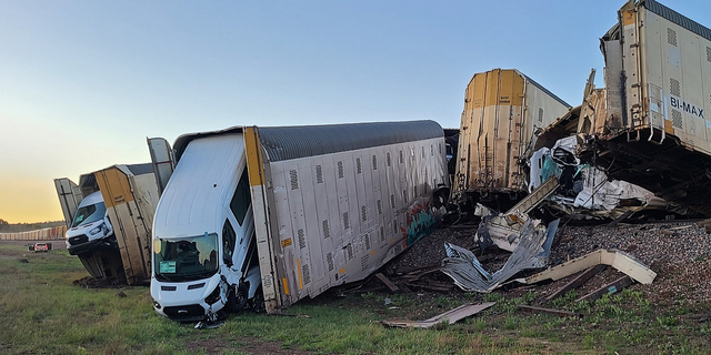 Train carrying new vehicles derails in Arizona