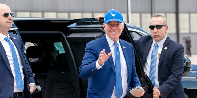 President Joe Biden waves