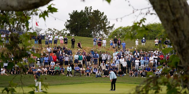 Bryson DeChambeau hits putt