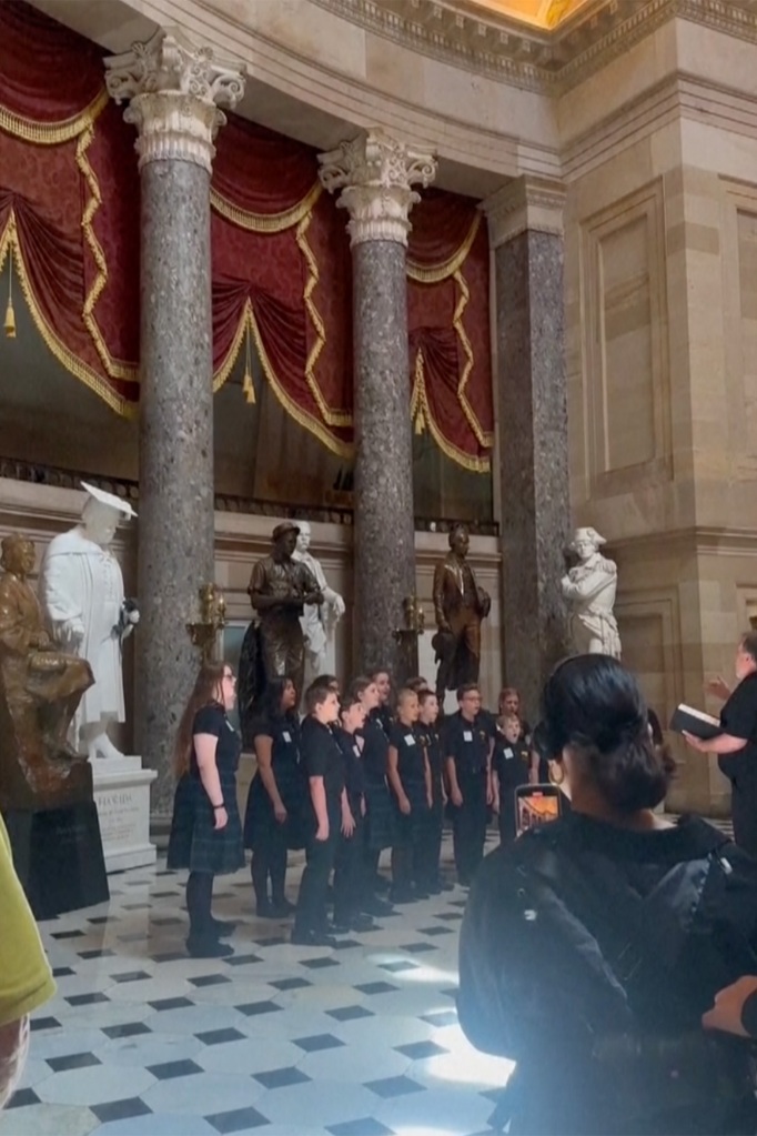 Video footage of the event shows the conductor of the group, David Rasbach, cutting the young singers off before they could finish singing the patriotic tune. 