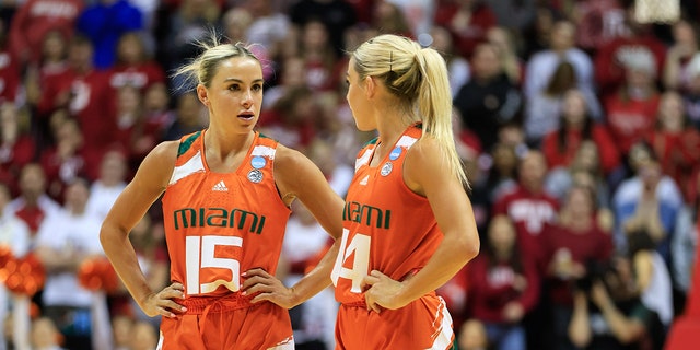 Haley and Hanna Cavinder talk on court