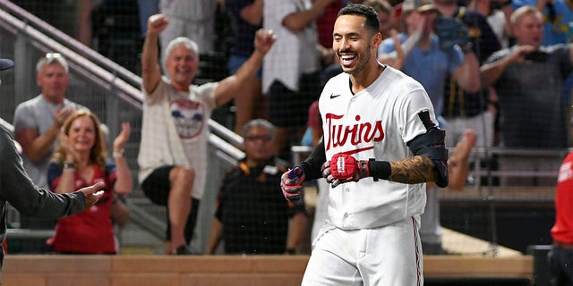 Carlos Correa celebrates