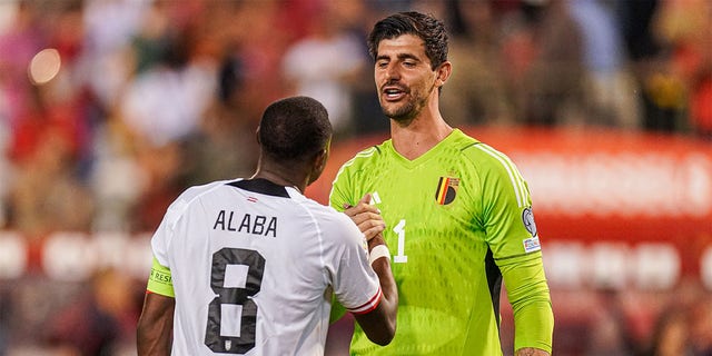 David Alaba and Thibaut Courtois embrace