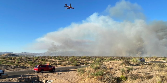 fire plane flying over smoke