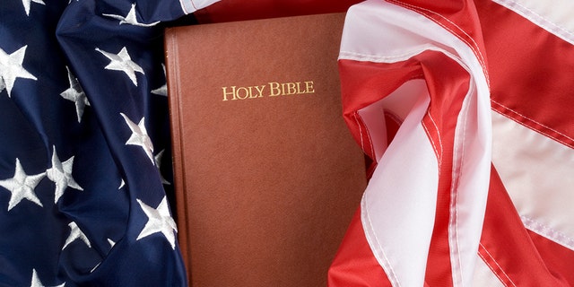 Holy bible in US flag. Close up.