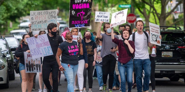 Pro-choice activists approach the home of U.S. Supreme Court Justice Brett Kavanaugh