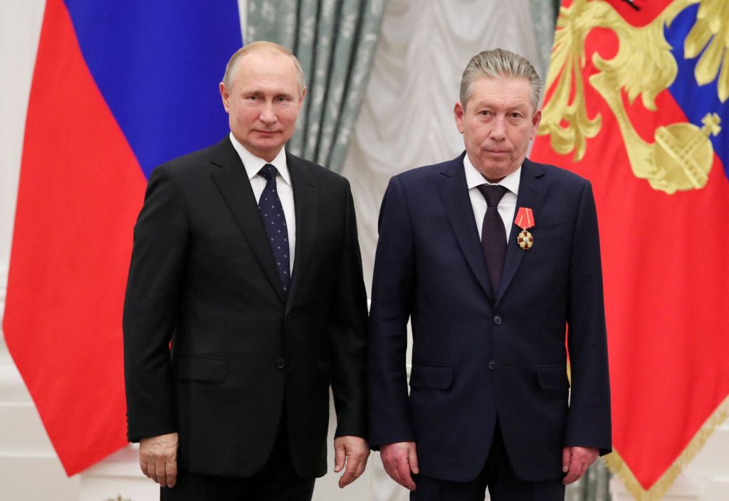 Russia's President Vladimir Putin (L) and Chairman of the Board of Directors of Oil Company Lukoil Ravil Maganov -- who fell to his death last week.