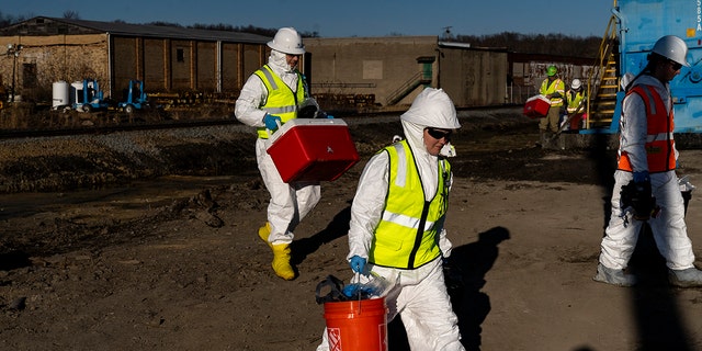 People in hazmat clothing