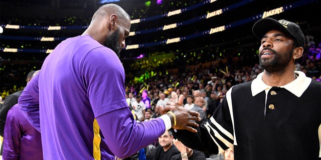 Kyrie Irving and LeBron James shake hands