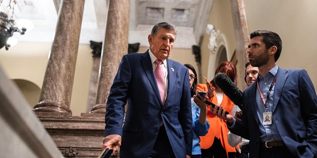 Joe Manchin greeted by press on Capitol Hill