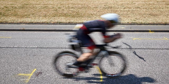 An athlete passes the site of the crash