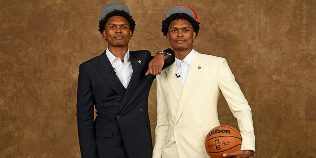 Amen Thompson and Ausar Thompson take a picture at the NBA Draft