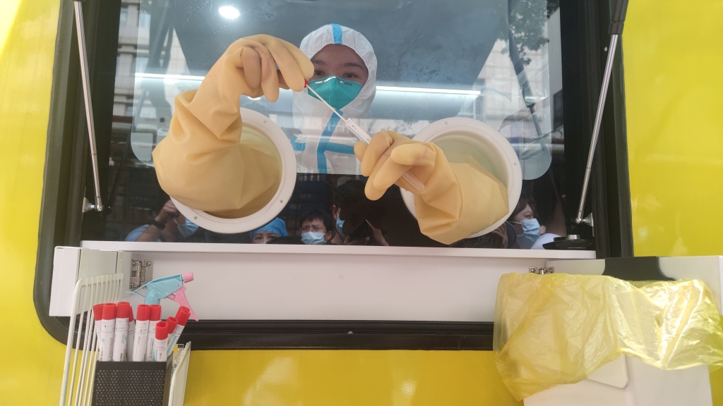 A medical worker is seen in a mobile COVID-19 nucleic acid testing laboratory on August 5, 2021 in Wuhan, Hubei Province of China.