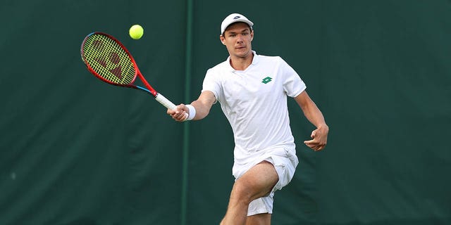 Kamil Majchrzak plays during Wimbledon in 2022