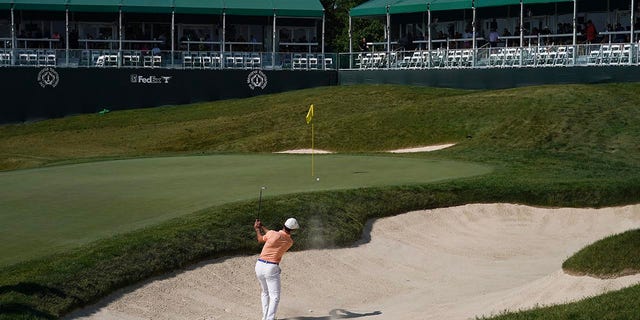 Billy Horschel plays a bunker shot