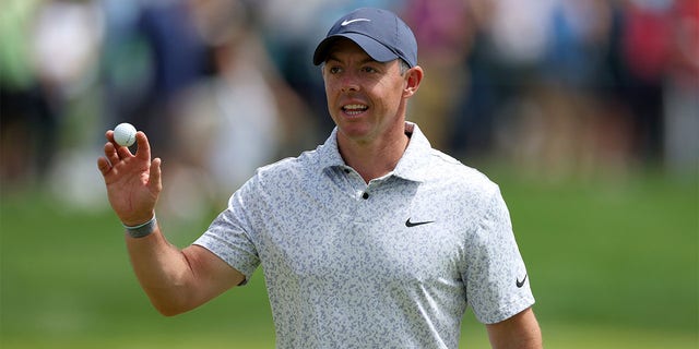 Rory McIlroy waved after making a hoile-in-one