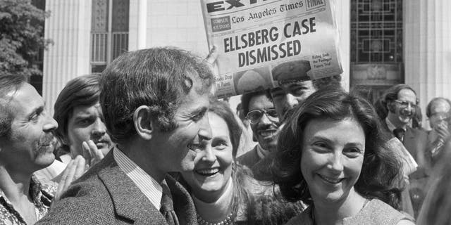 Ellsberg smiling with wife