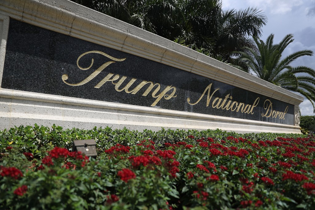 A sign reading Trump National Doral is seen on the grounds of the golf course owned by Republican presidential candidate Donald Trump on June 1, 2016 in Doral, Florida. 