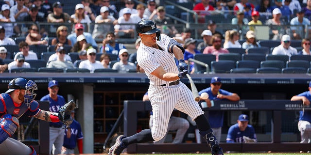 Giancarlo Stanton swings