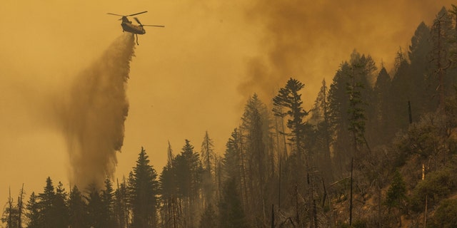 Helicopter dumping water