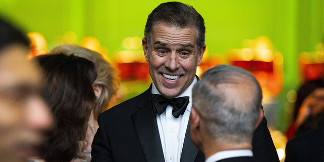 Hunter Biden in black coat and tie at state dinner